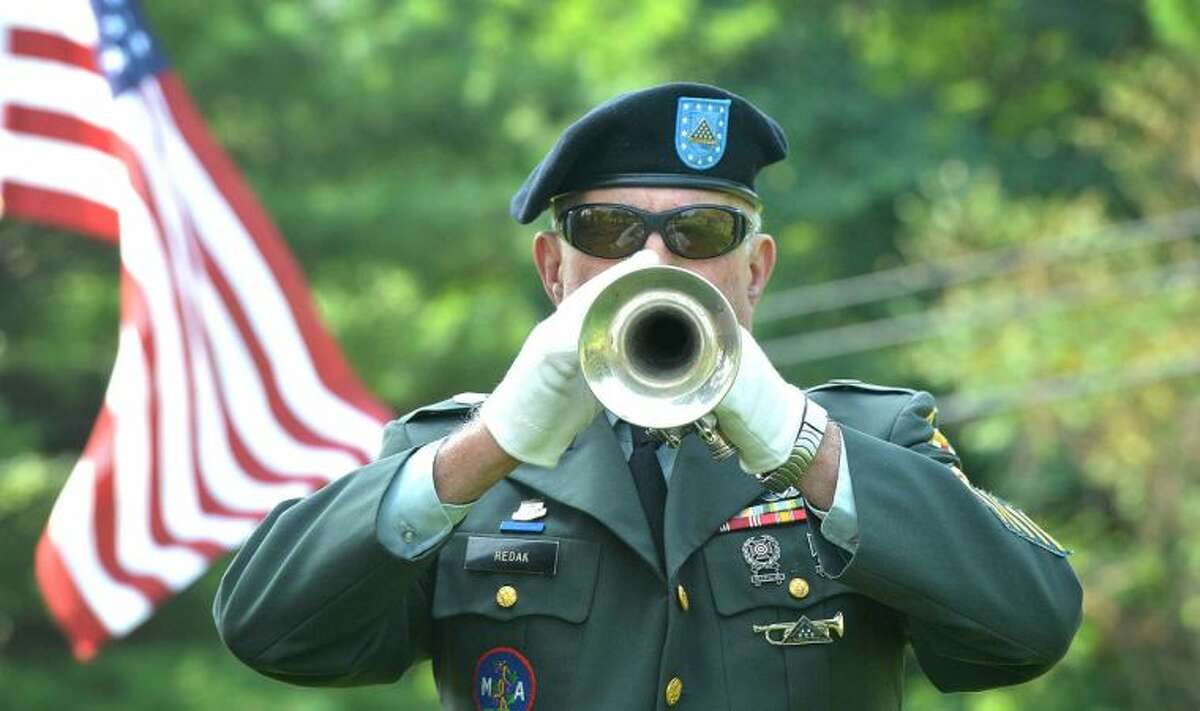Hour Photo/Alex von Kleydorff The 1st Company Governors Footguard Trumpeter Harvey Redak, U.S. Army, Ret. plays The National Anthem for the 5th Annual Housing for Heroes Connecticut Golf Classic