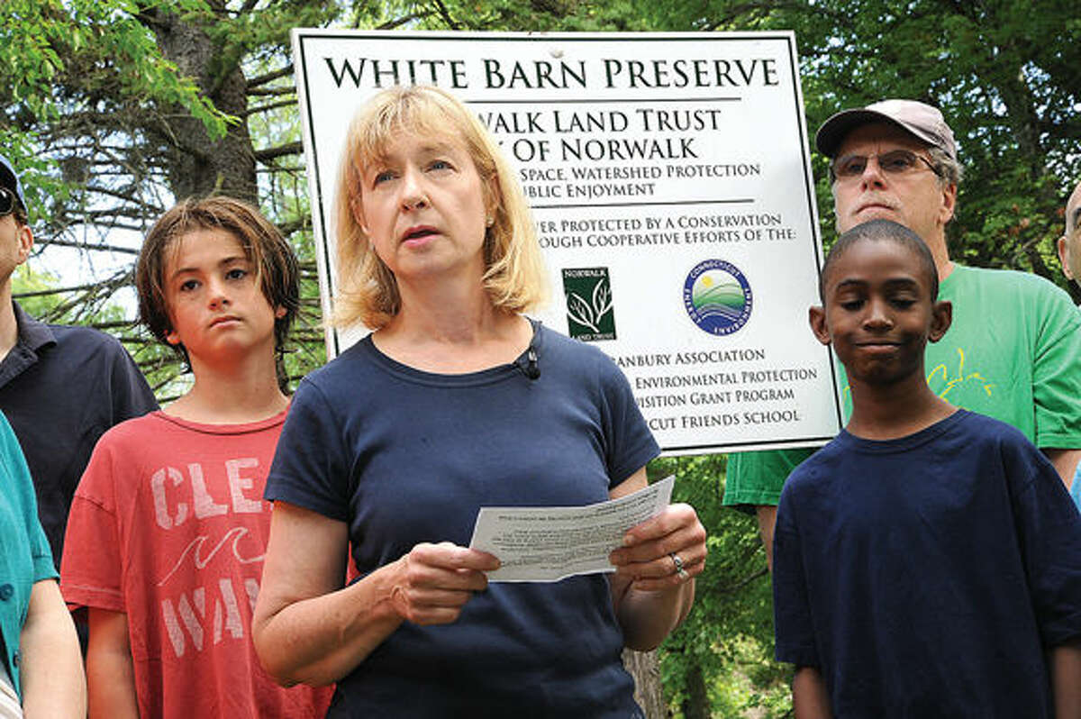 In this file photo, Joann Jackson with the Norwalk Landtrust speaks Saturday at the press conference and cleanup of the White Barn Preserve along with members of The Westport RTM and Save Westport Now on Saturday. Hour photo/Matthew Vinci