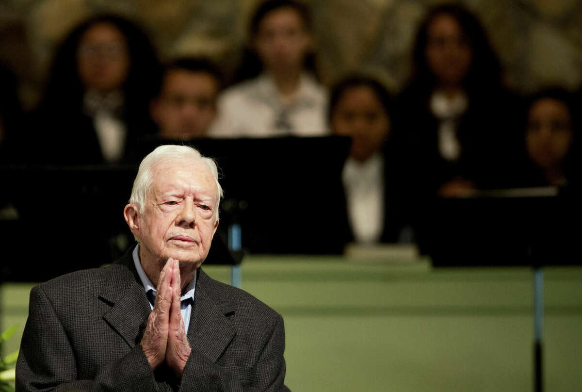 Former President Jimmy Carter teaches Sunday School class at Maranatha Baptist Church in his hometown Sunday, Aug. 23, 2015, in Plains, Ga. The 90-year-old Carter gave one lesson to about 300 people filling the small Baptist church that he and his wife, Rosalynn, attend. It was Carter's first lesson since detailing the intravenous drug doses and radiation treatment planned to treat melanoma found in his brain after surgery to remove a tumor from his liver. (AP Photo/David Goldman)