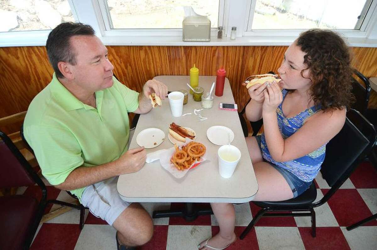 Hour Photo/Alex von Kleydorff Wilton's Mike LeBeau enjoys hot dogs for lunch with his daughter Macy at Swanky Franks in Norwalk