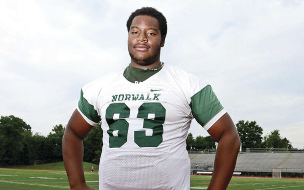 Hour photo/Erik Trautmann The Hour's 2013-14 Male Athlete of the Year, Norwalk High lineman and track and field athlete Evan Adams.
