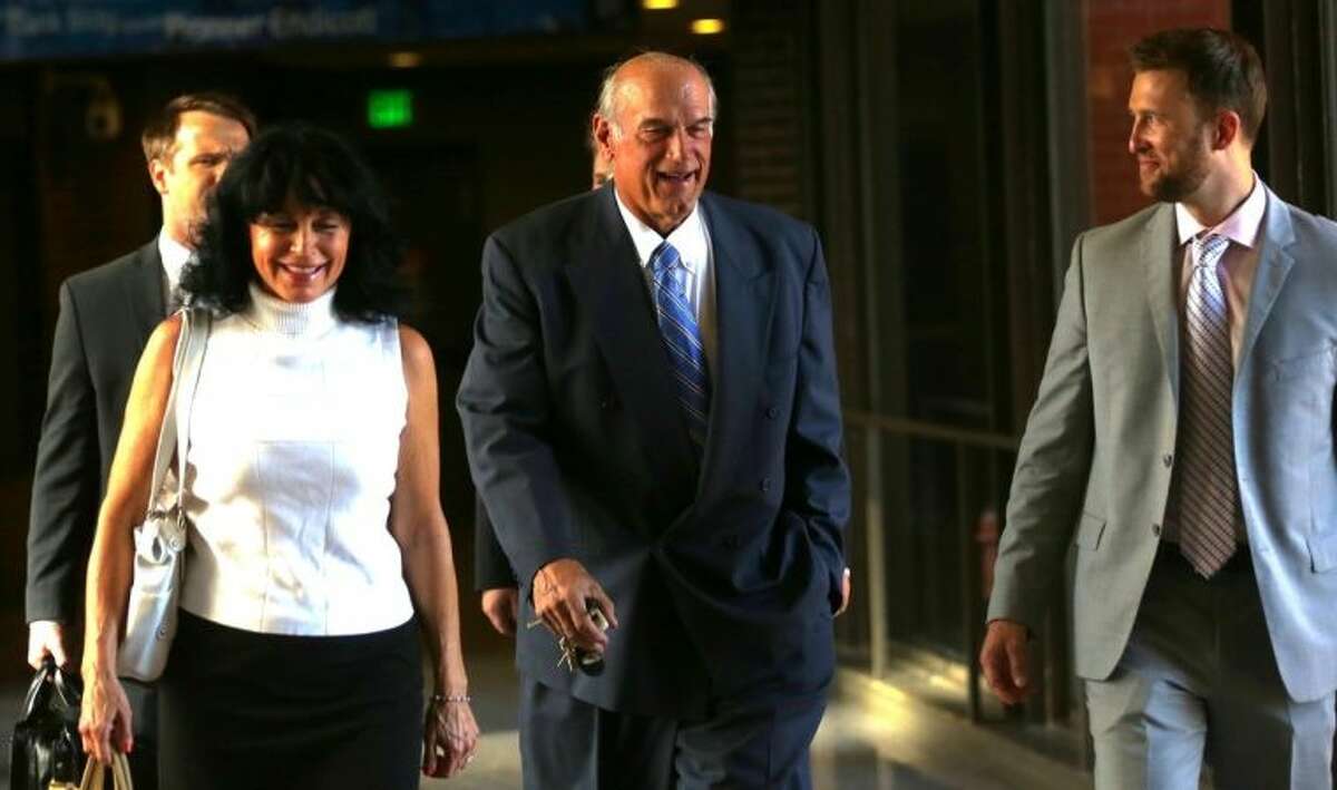 FILE - In this July 22, 2014 file photo former Minnesota Gov. Jesse Ventura, center, arrives at court with his wife, Terry, and others for his defamation lawsuit against "American Sniper" author Chris Kyle in St. Paul, Minn. Kyle wrote in his best-seller that he decked Ventura in a California bar in 2006 after Ventura allegedly said Navy SEALs "deserve to lose a few." Ventura, a former SEAL and pro wrestler, testified Kyle fabricated the story. Kyle denied that in testimony videotaped before his death last year. (AP Photo/The Star Tribune, Jim Gehrz, File) MANDATORY CREDIT; ST. PAUL PIONEER PRESS OUT; MAGS OUT; TWIN CITIES LOCAL TELEVISION OUT