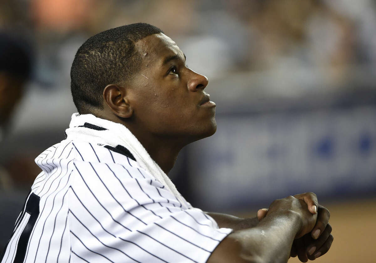 New York Yankees starting pitcher Luis Severino looks on after being taken out of the game by Yankees manager Joe Girardi in the seventh inning of a baseball game against the Tampa Bay Rays at Yankee Stadium on Friday, Sept. 4, 2015, in New York. (AP Photo/Kathy Kmonicek)