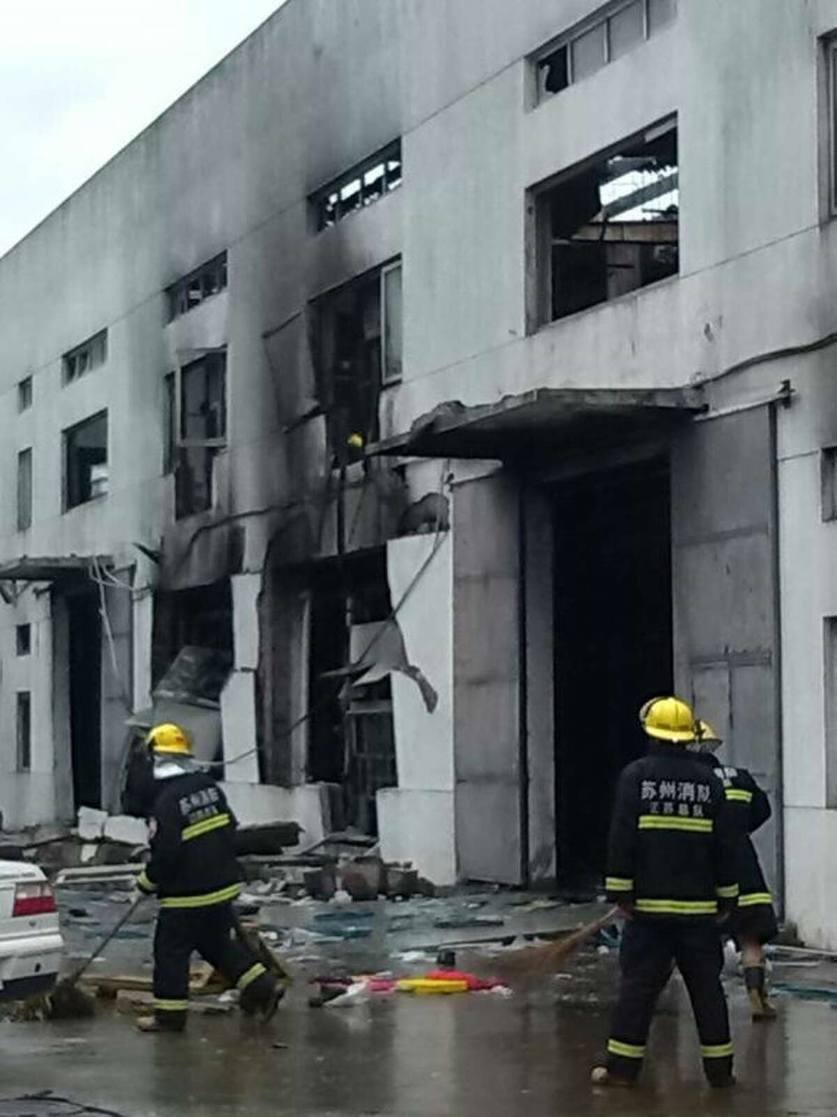 This photo released by China's Xinhua News Agency shows the site of an explosion at an eastern Chinese automotive parts factory in Kunshan City, Jiangsu Province Saturday, Aug. 2, 2014. Dozens of people were killed Saturday by the explosion at the factory that supplies General Motors, state media reported. (AP Photo/Xinhua, Wang Hengzhi) NO SALES