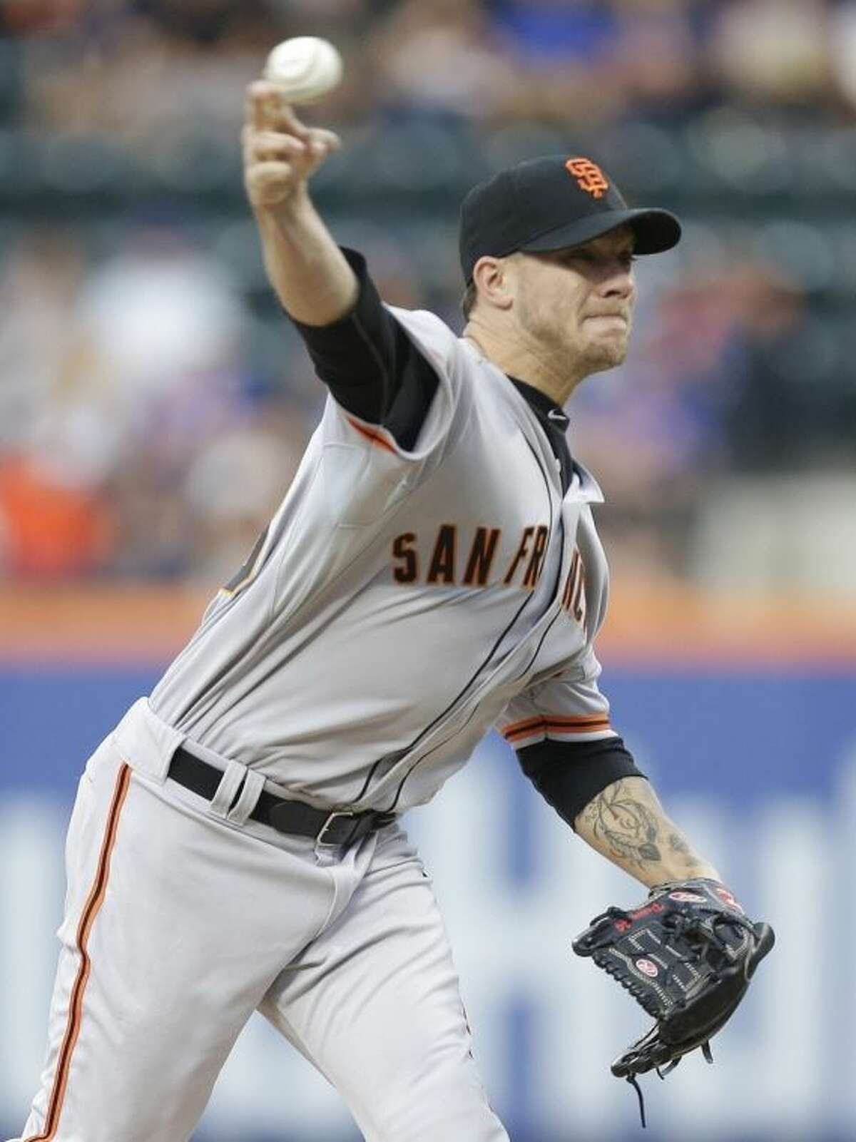 San Francisco Giants' Jake Peavy delivers a pitch during the first inning of a baseball game against the New York Mets on Saturday, Aug. 2, 2014, in New York. (AP Photo/Frank Franklin II)
