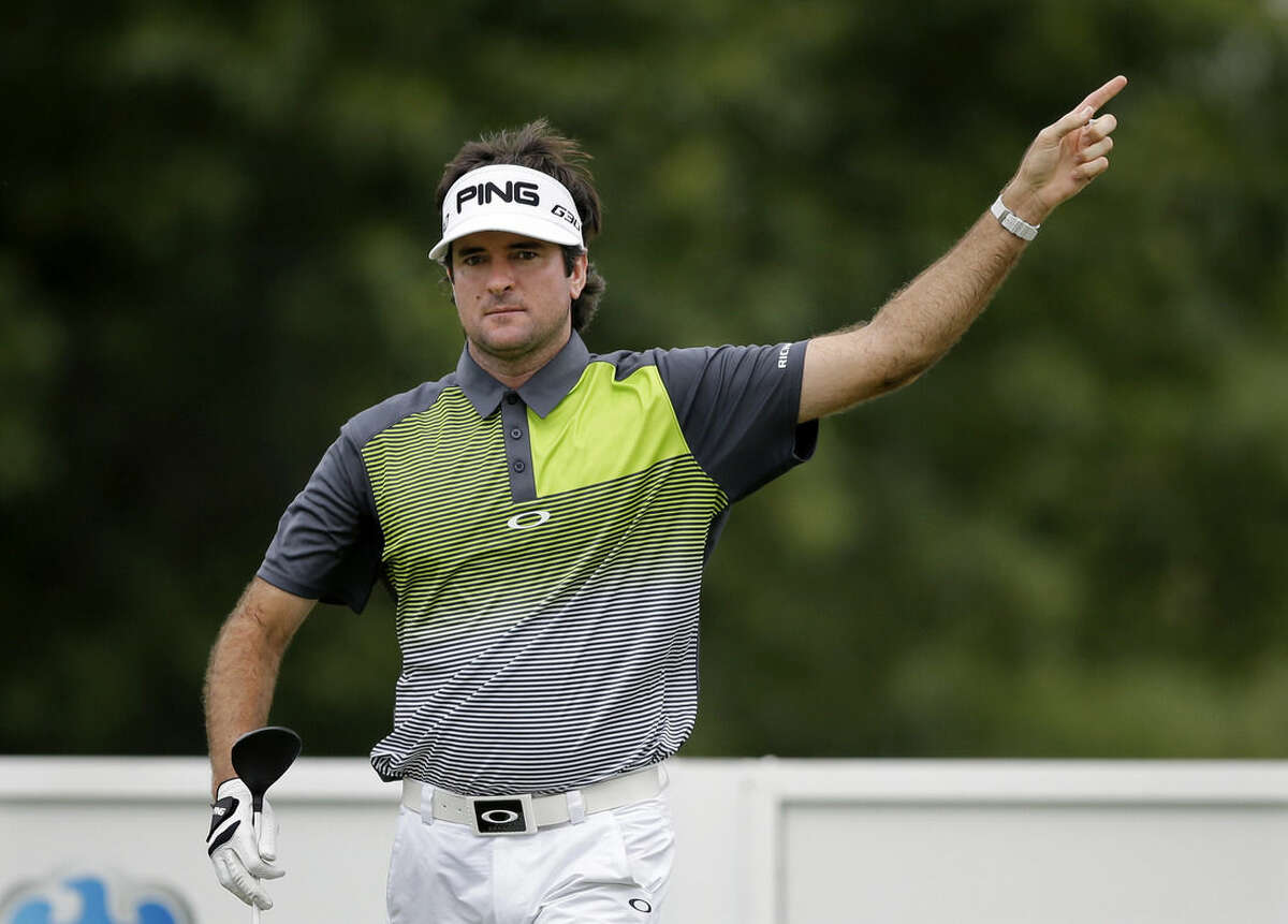 Bubba Watson signals that his tee shot went off course on the ninth hole during the final round of play at The Barclays golf tournament Sunday, Aug. 30, 2015, in Edison, N.J. (AP Photo/Mel Evans)