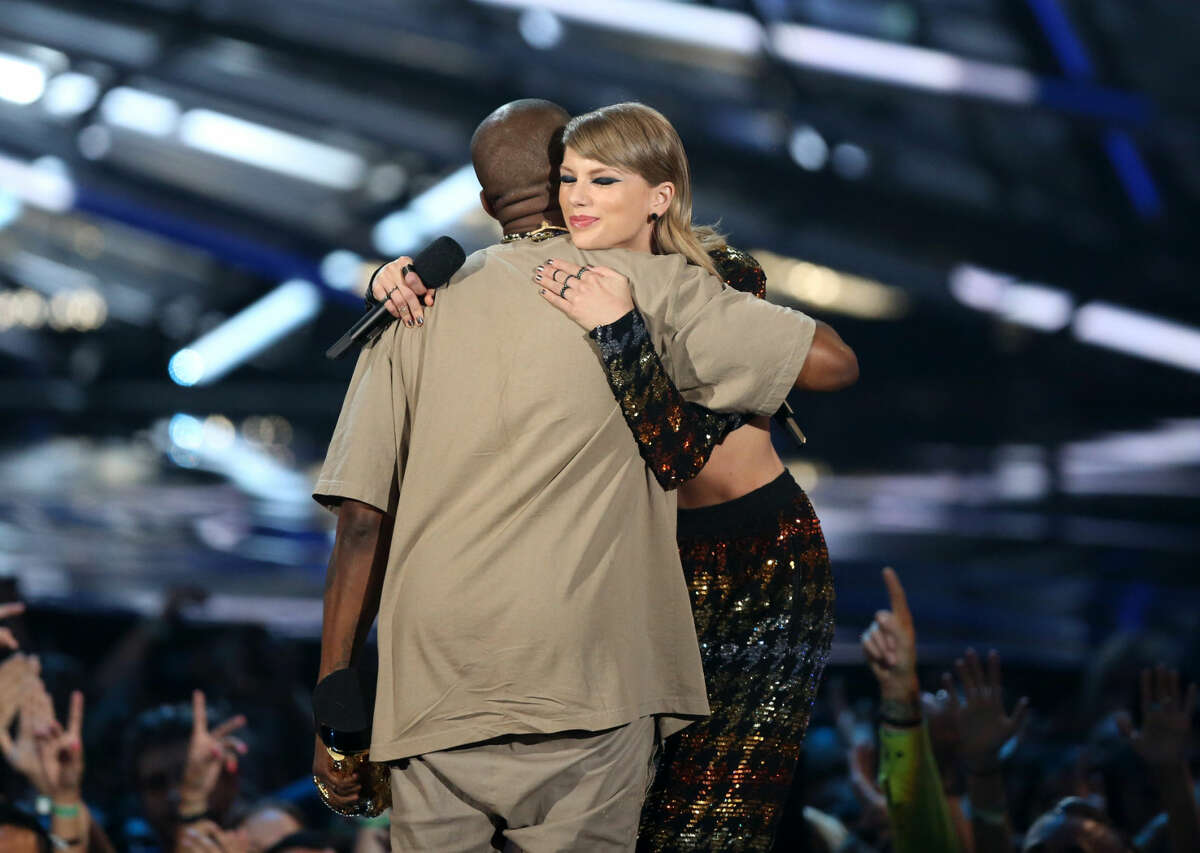 Taylor Swift, right, embraces Kanye West after presenting him with the video vanguard award at the MTV Video Music Awards at the Microsoft Theater on Sunday, Aug. 30, 2015, in Los Angeles. (Photo by Matt Sayles/Invision/AP)