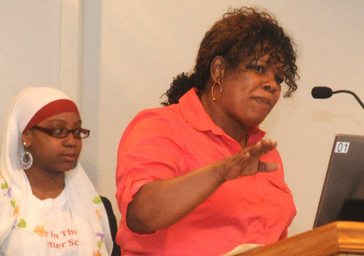 Gwen Samuel with the Connecticut Parents Union speaks out Tuesday night at Norwalk City Hall calling on the resignation of two Board of Education members. Hour photo/Matthew Vinci