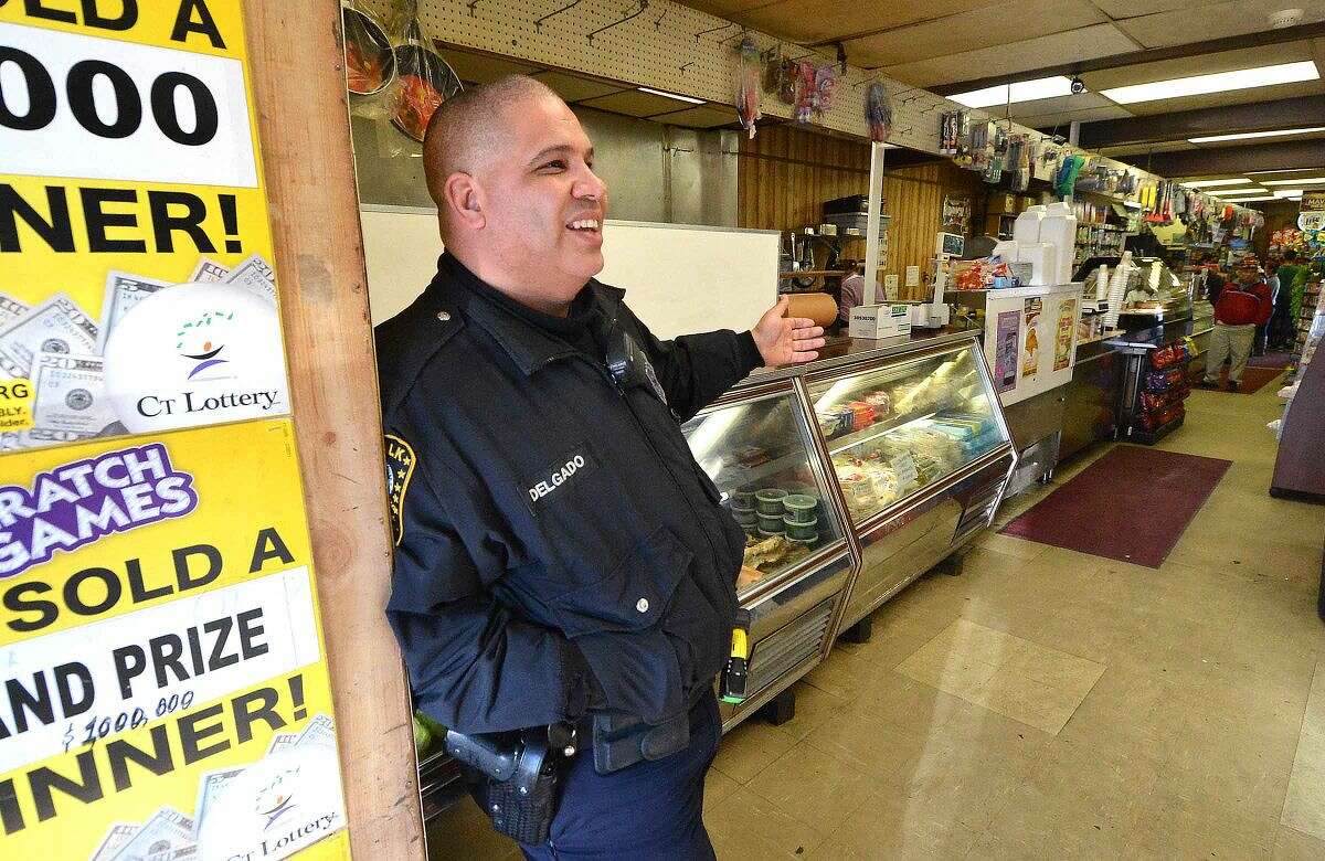 Hour Photo/Alex von Kleydorff In this file photo, Norwalk Police Officer Hector Delgado at C&S Grocery in his old neighborhood