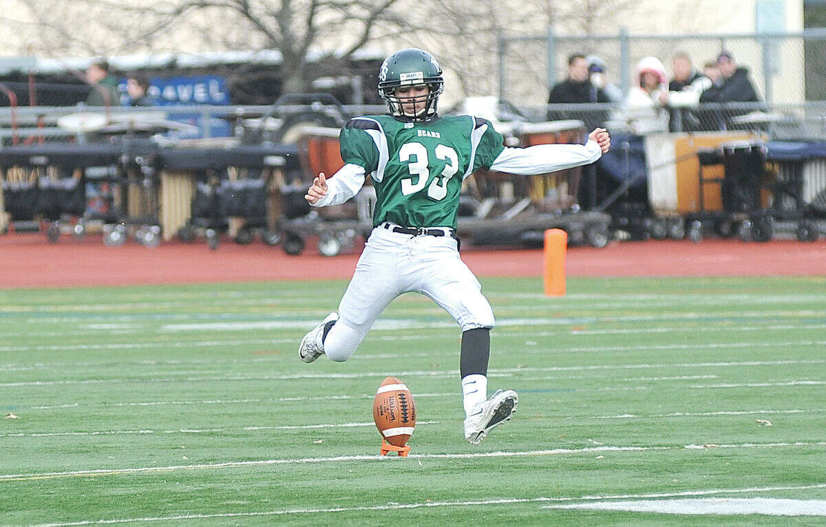 Norwalk high kicker Michael Denke kicks off during the Bears game against Brien McMahon last Thanksgiving Day, the last time either of the city teams played a real football game. Both Norwalk and McMahon, and most of the remaining teams in the FCIAC, open their seasons on Friday. (Hour photo/John Nash)