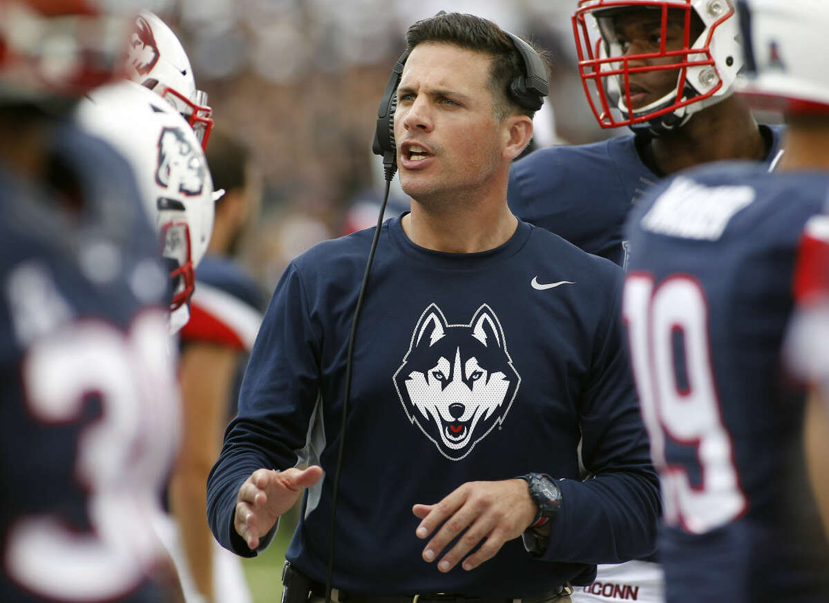Connecticut head coach Bob Diaco talks with his defense during the fourth quarter of of an NCAA college football game against Army at Pratt & Whitney Stadium at Rentschler Field, Saturday, Sept. 12, 2015, in East Hartford, Conn. (AP Photo/Stew Milne)
