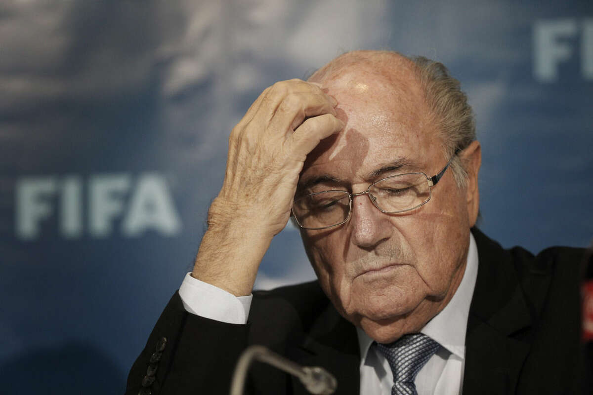 FILE - In this Dec. 19, 2014 file photo FIFA President Sepp Blatter gestures as he attends a press conference in Marrakech, Morocco. On Friday, Sept. 25, 2015 Swiss attorney general opened criminal proceedings against FIFA President Sepp Blatter. (AP Photo/Christophe Ena)