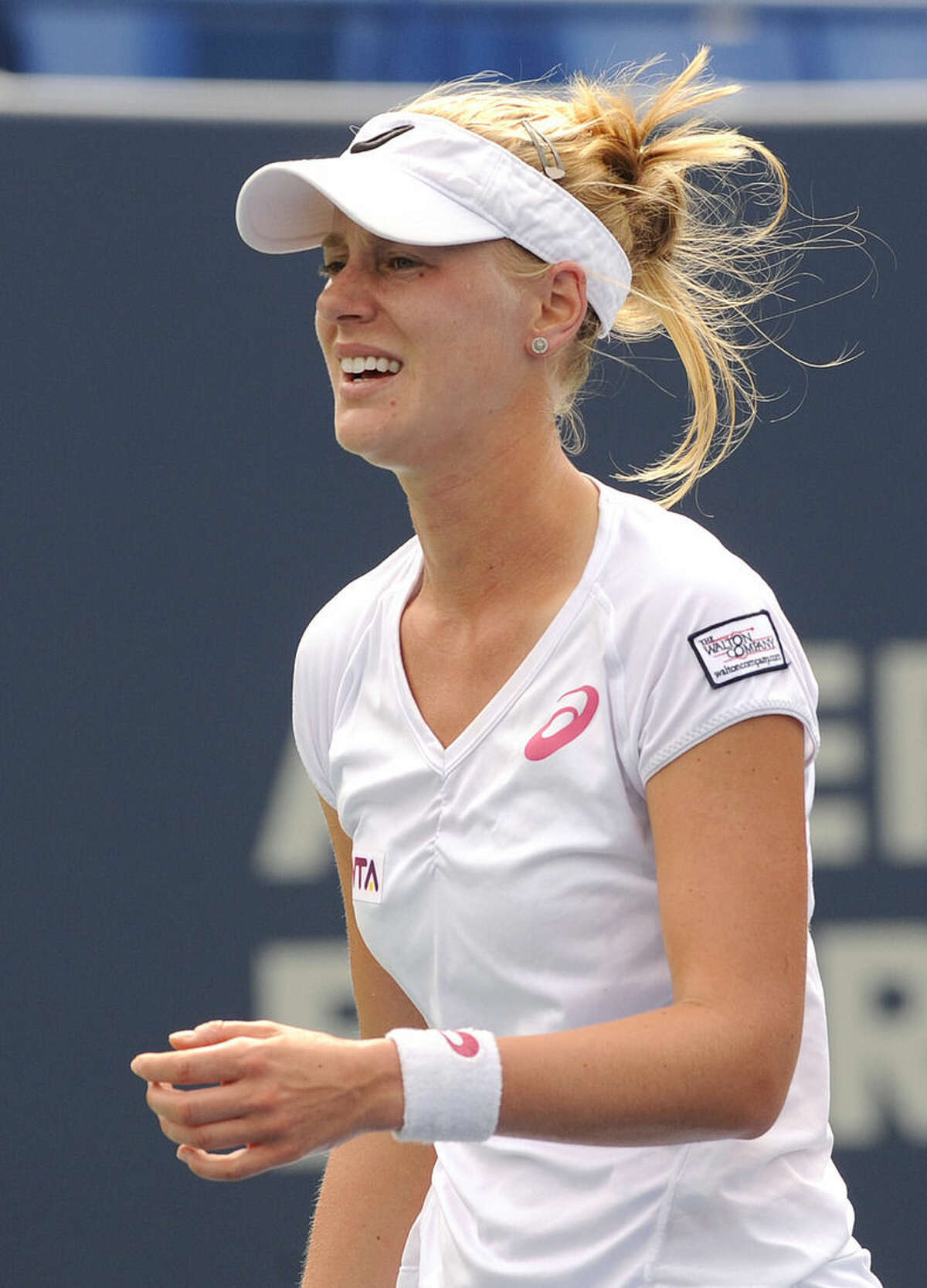 Alison Riske, of the United States, reacts after losing a point during a quarterfinal match against Magdalena Rybarikova, of Slovakia, at the New Haven Open tennis tournament in New Haven, Conn., on Thursday, Aug. 21, 2014. Riske lost the match 7-5, 0-6, 6-4. (AP Photo/Fred Beckham)