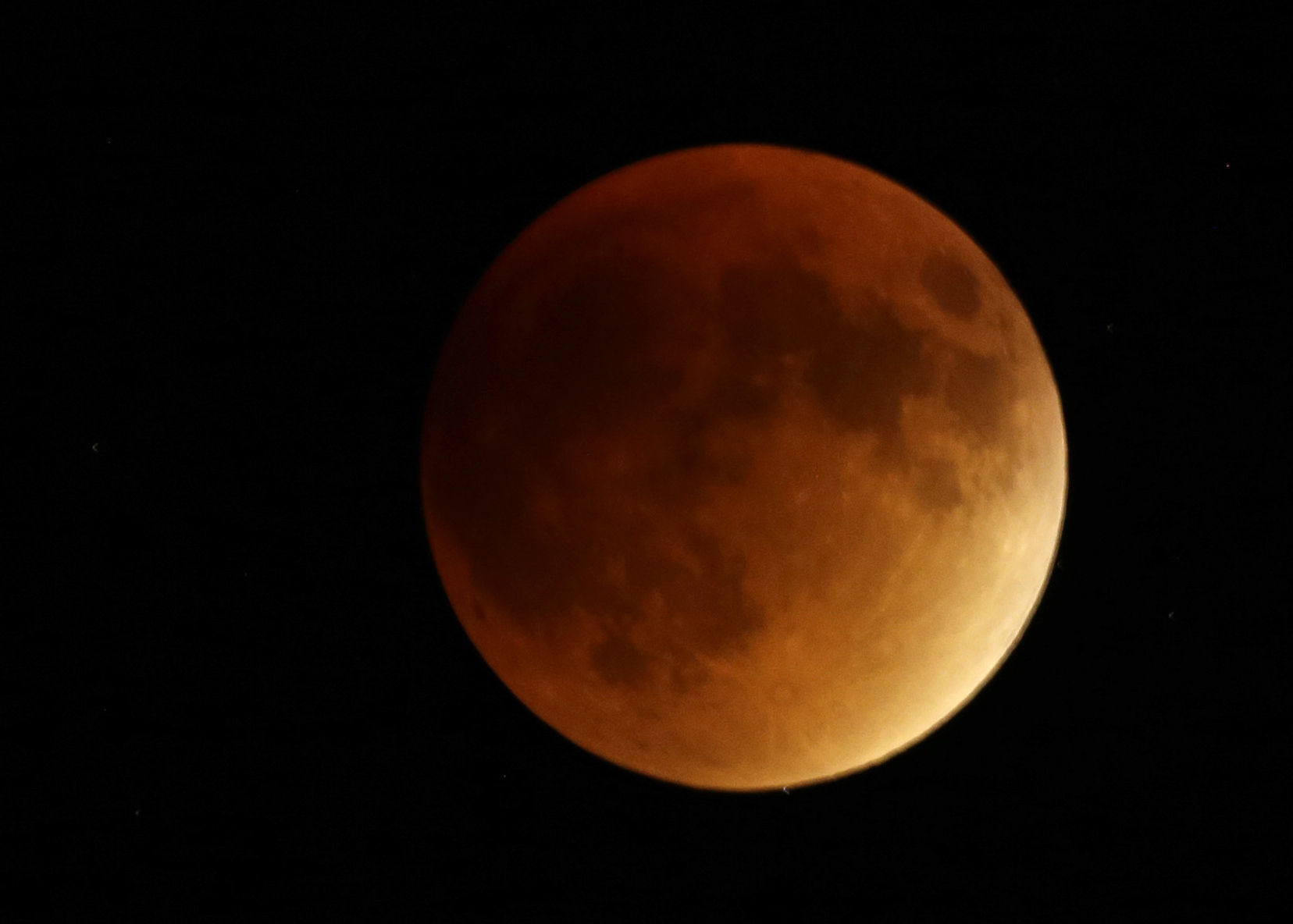 Supermoon lunar eclipse from around the globe