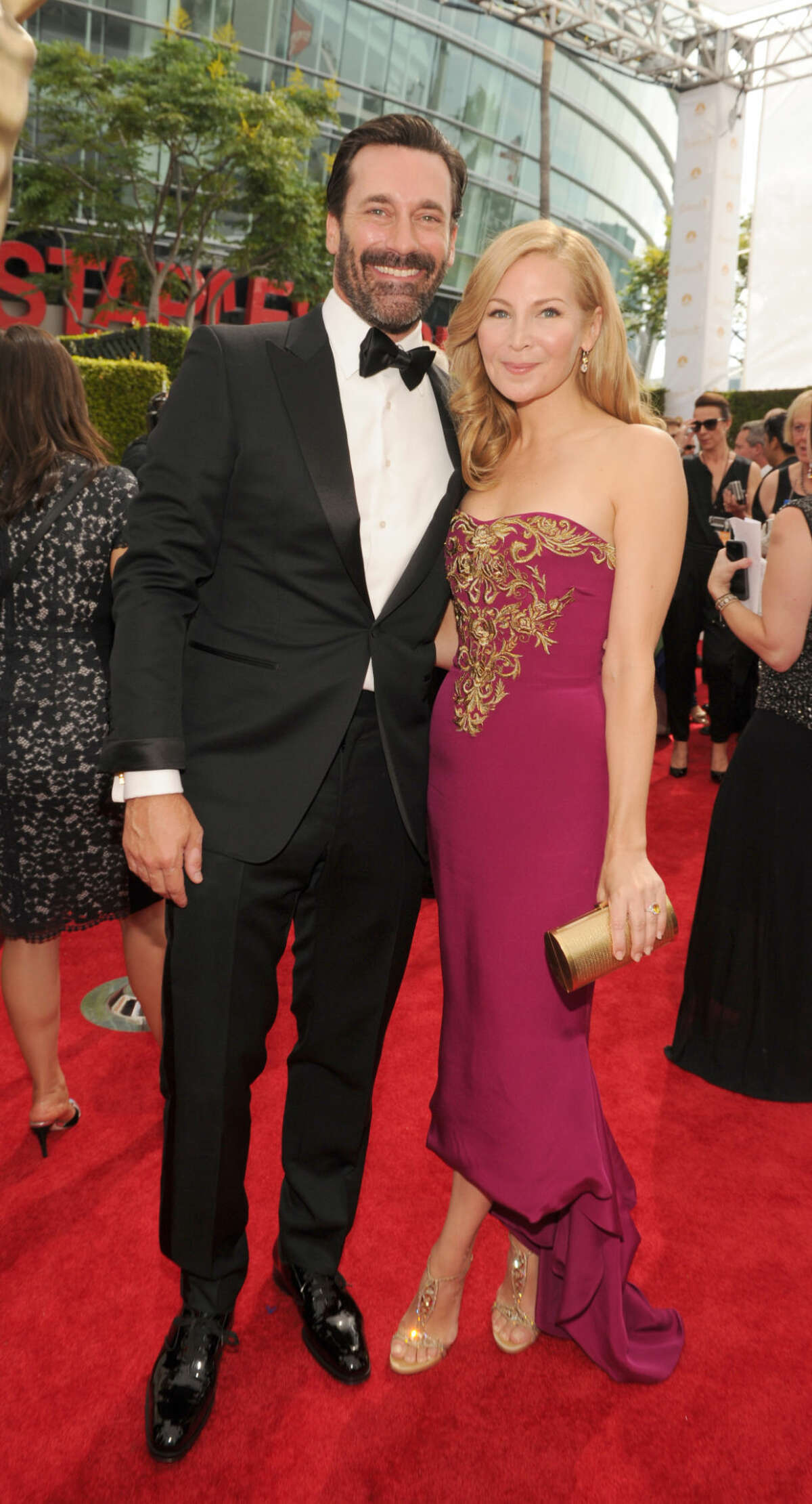 IMAGE DISTRIBUTED FOR THE TELEVISION ACADEMY - Actor Jon Hamm, left, and actress Jennifer Westfeldt arrive at the 66th Primetime Emmy Awards at the Nokia Theatre L.A. Live on Monday, Aug. 25, 2014, in Los Angeles. (Photo by Frank Micelotta/Invision for the Television Academy/AP Images)