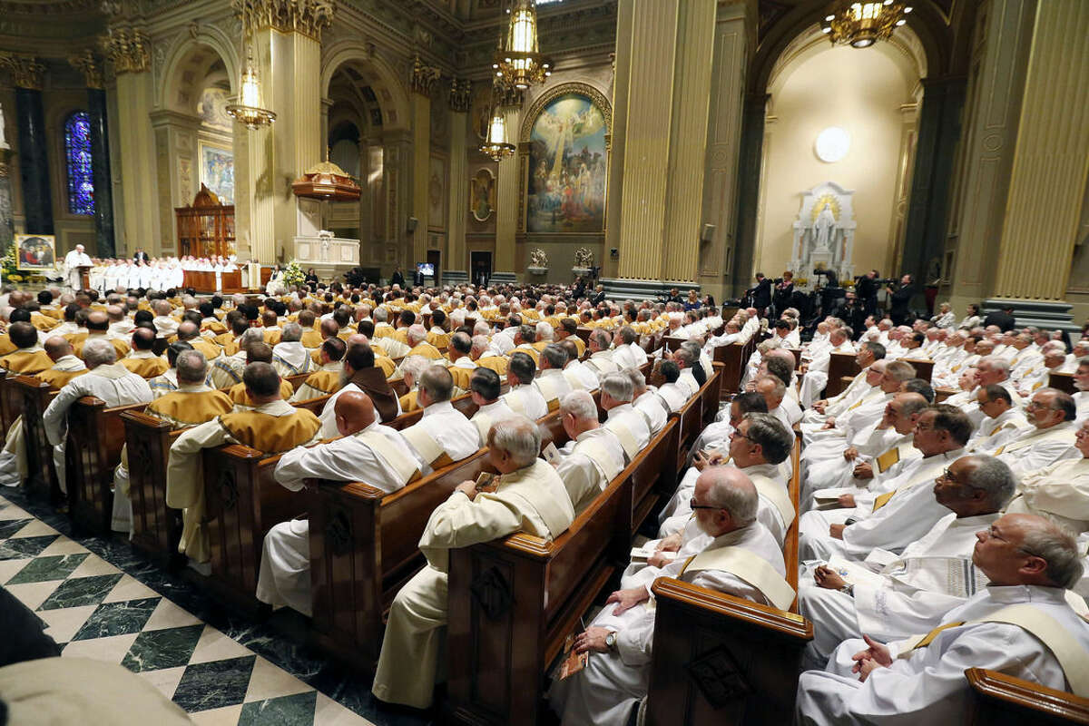 The congregation listens as Pope Francis gives his homily during a Mass at Cathedral Basilica of Sts. Peter and Paul, Saturday, Sept. 26, 2015, in Philadelphia. (AP Photo/Julio Cortez)