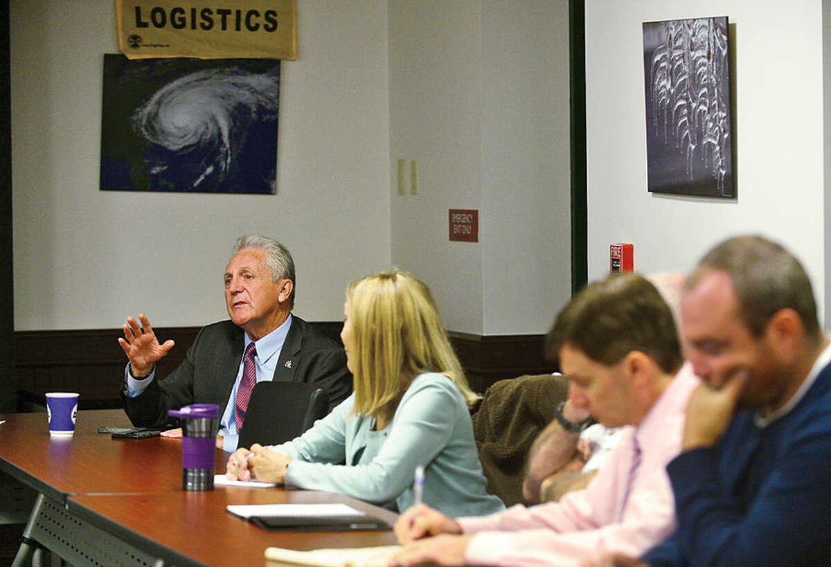 Hour photo / Erik Trautmann Mayor Harry Rilling speaks as Norwalk’s Emergency Management Team meets in the Emergency Operations Center Friday morning for an update and briefing in advance of the approach of Hurricane Joaquin.