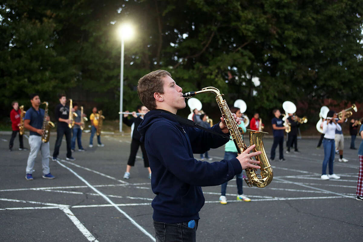 Trey Spadone performs during Brien McMahon Marching Band's practice for the NYC Columbus Day Parade Thursday evening. Hour Photo / Danielle Calloway