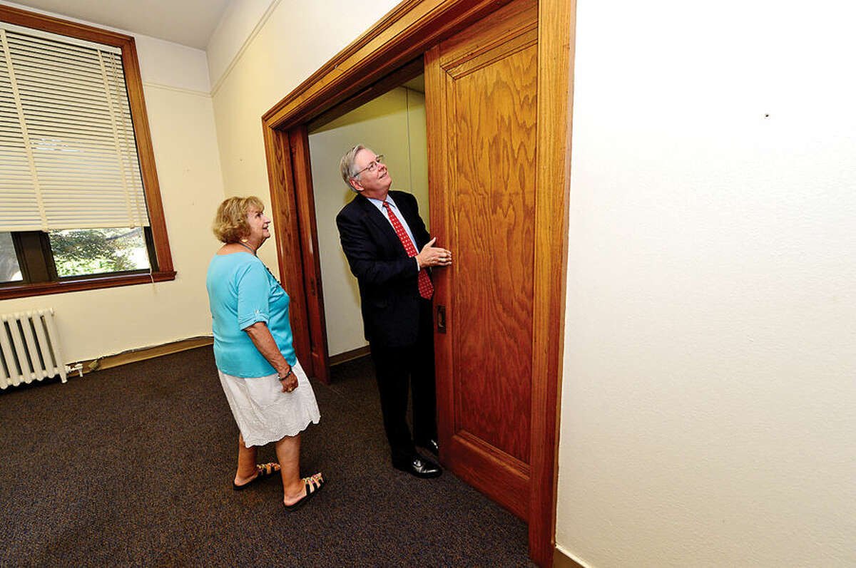 Hour photo / Erik Trautmann Stamford Mayor David Martin tours the former Sacred Heart Academy with Stamford Board representative Eileen Heaphy following a presentation of the keys ceremony at the former Sacred Heart Academy which the city purchased Thursday .
