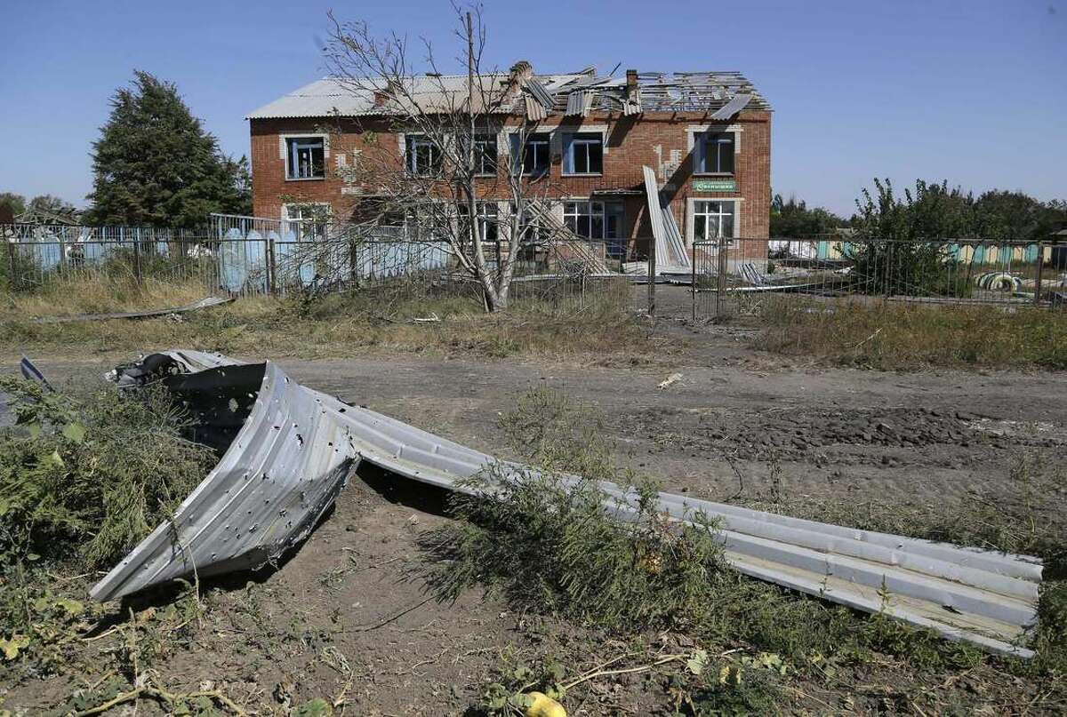 A destroyed kindergarten building is seen in the village of Kominternove , Ukraine, Saturday, Sept. 6, 2014. After four months of war, eastern Ukraine begins the first full day of an uncertain cease-fire. The truce agreement calls for an exchange of prisoners and establishment of humanitarian corridors, but how quickly those actions will begin is unclear. (AP Photo/Sergei Grits)