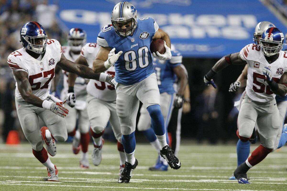 Detroit Lions tight end Joseph Fauria (80) breaks for a 26-yard run during the third quarter of an NFL football game against the New York Giants in Detroit, Monday, Sept. 8, 2014. (AP Photo/Duane Burleson)