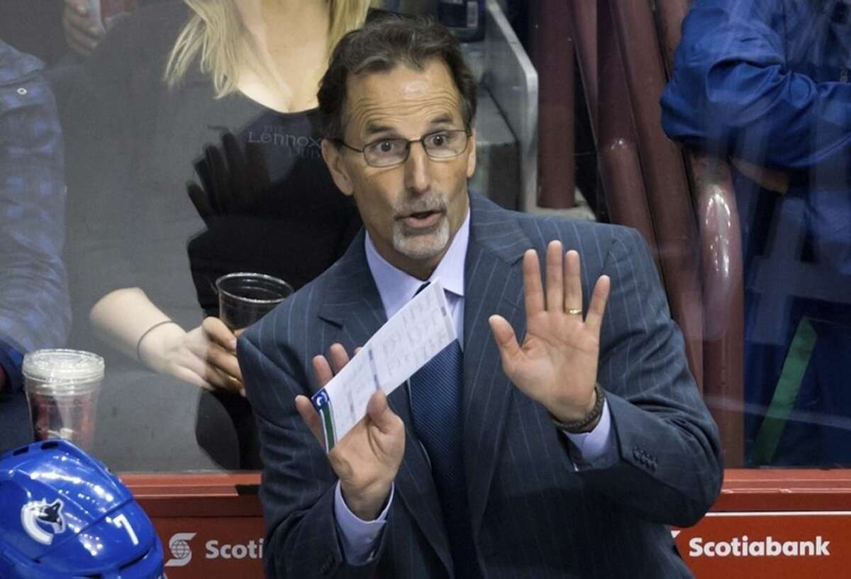 FILE - In this March 19, 2014, file photo, then-Vancouver Canucks head coach John Tortorella gestures on the bench during third period of an NHL hockey action against the Nashville Predators in Vancouver, British Columbia. After an 0-7 start, the Blue jackets have fired coach Todd Richards and replaced him with John Tortorella, Wednesday, Oct. 21, 2015. (AP Photo/The Canadian Press, Darryl Dyck)