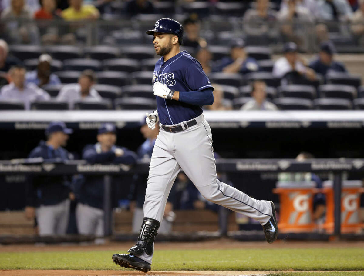 Tampa Bay Rays James Loney runs the bases after hitting a second-inning solo home run off New York Yankees starting pitcher Hiroki Kuroda in a baseball game at Yankee Stadium in New York, Tuesday, Sept. 9, 2014. (AP Photo/Kathy Willens)
