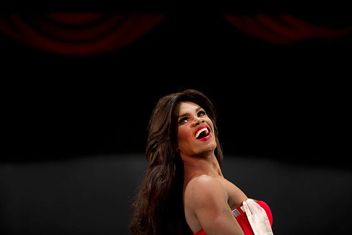 In this Oct. 18, 2015 photo, contestant Alfredo Lopez, Miss Gay Miranda, competes at the ninth annual Miss Gay Venezuela beauty pageant in Caracas, Venezuela. Some of the contestant's evening gowns are from Venezuela's top designers who also work with the Miss Venezuela organization. (AP Photo/Ariana Cubillos)