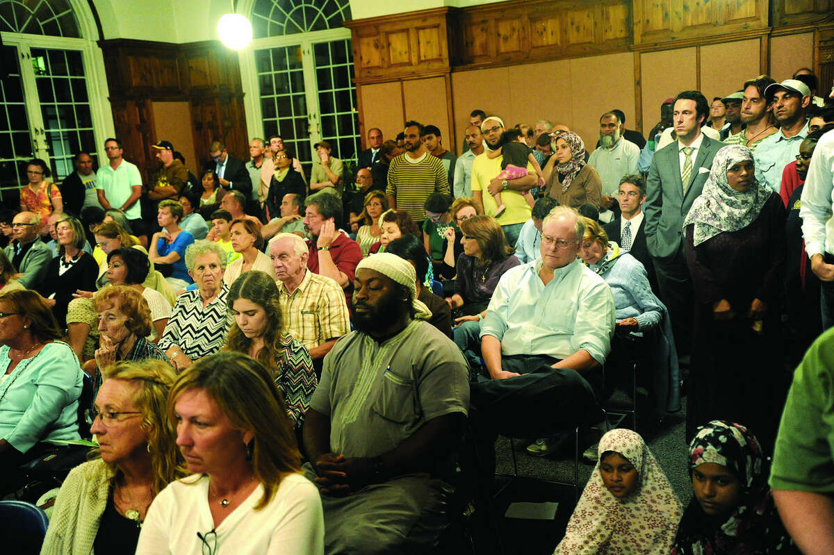 Residents fill the Community Room at Norwalk City Hall Tuesday night as the Common Council votes on the monetary portion of the proposed settlement between Norwalk and the Al Madany Islamic Center of Norwalk. Hour photo/Matthew Vinci