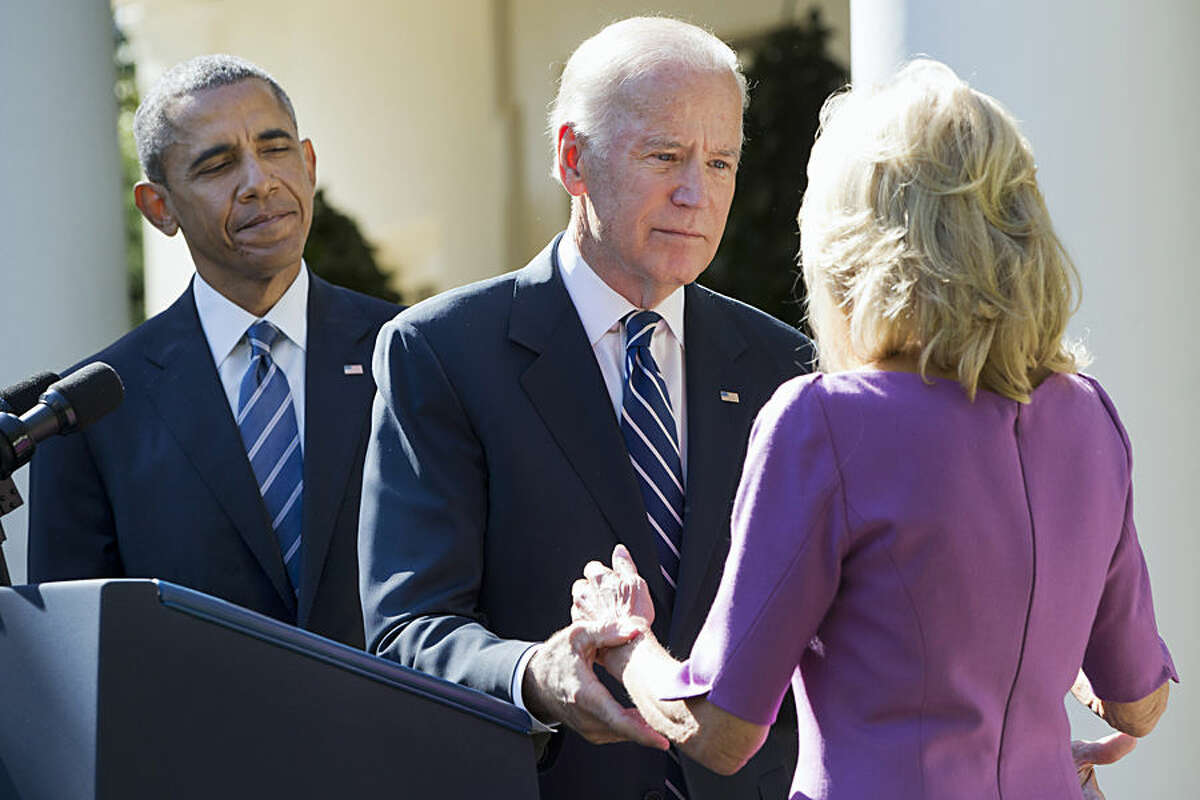 President Barack Obama watches as Vice President Joe Biden turns to his wife Dr. Jill Biden after announcing that he will not run for the presidential nomination, Wednesday, Oct. 21, 2015, in the Rose Garden of the White House in Washington. (AP Photo/Jacquelyn Martin)