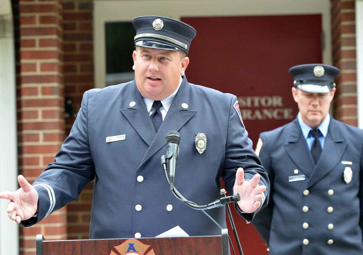 Hour Photo/Alex von Kleydorff Jason Mumbach speaks during Wilton's 13th Annual 9-11 Memorial Service at Wilton fire Headquarters