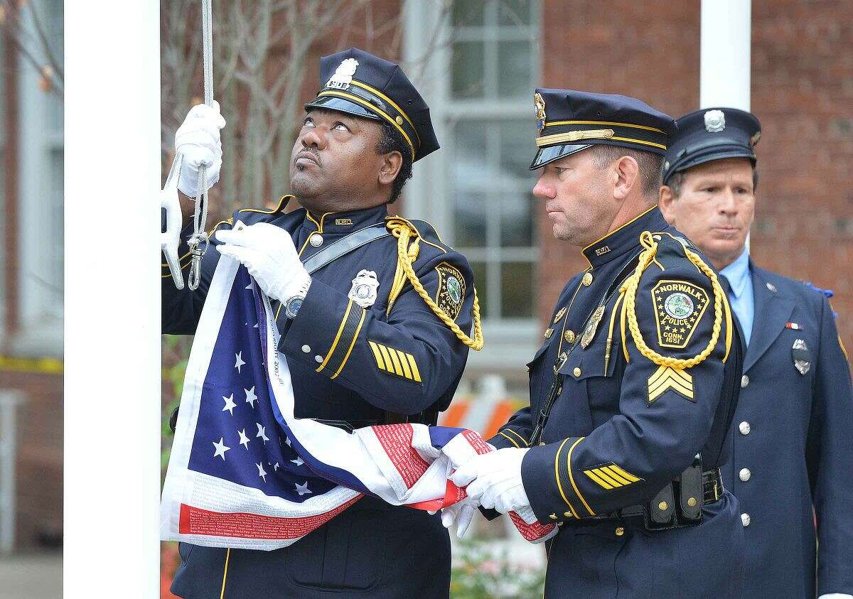 Hour Photo/Alex von Kleydorff The Honor Guard raises the colors during Norwalk Remembers , 9-11 Rememberance Ceremony at City Hall