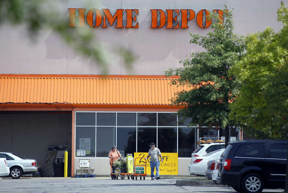 Customers push carts of goods from the Home Depot store in Cranberry, Pa., on Wednesday, Sept. 10, 2014. Home Depot?’s data breach could wind up being among the largest ever for a retailer, but that may not matter to its millions of customers. (AP Photo/Keith Srakocic)