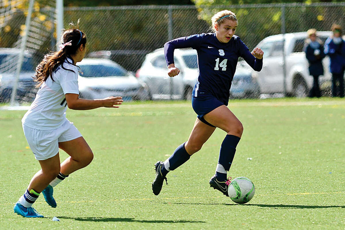 Hour photo / Erik Trautmann Staples High School girls soccer takes on Wilton Saturday.