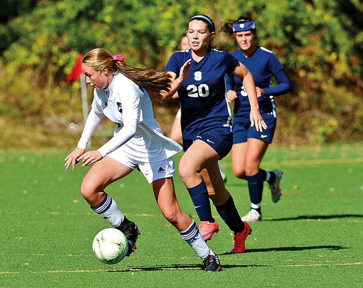 Hour photo / Erik Trautmann Staples High School girls soccer takes on Wilton Saturday.