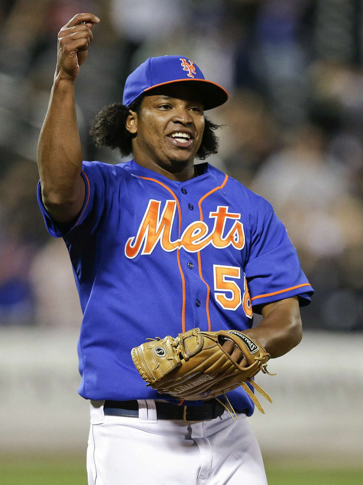 New York Mets relief pitcher Jenrry Mejia celebrates after the Mets defeated the Colorado Rockies 2-0 in a baseball game Wednesday, Sept. 10, 2014, in New York. (AP Photo/Frank Franklin II)