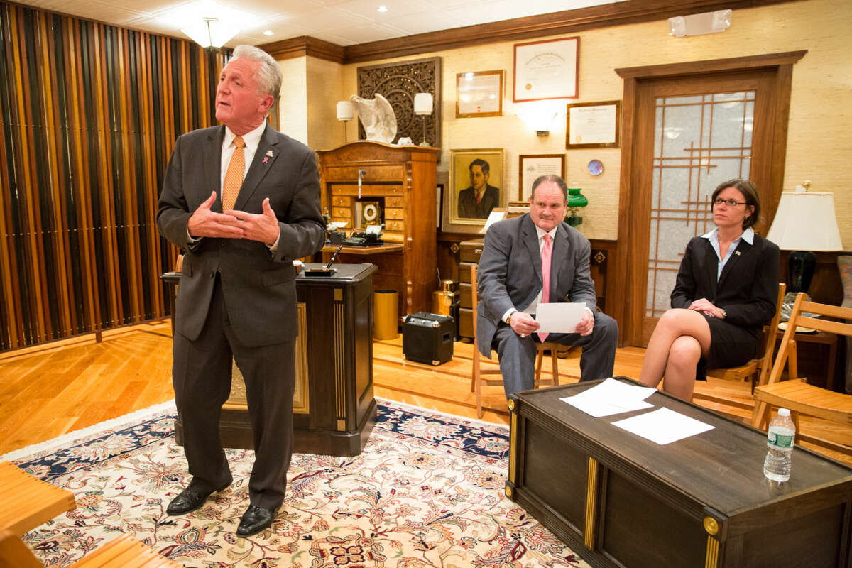 Hour photo/Chris Palermo Norwalk Mayor Harry Rilling speaks alongside his runningmate Kelly Straniti and mediator Winthrop Baum at the "Meet the Candidates" event hosted by the East Norwalk Business Association at 25 Van Zant St. Tuesday night.