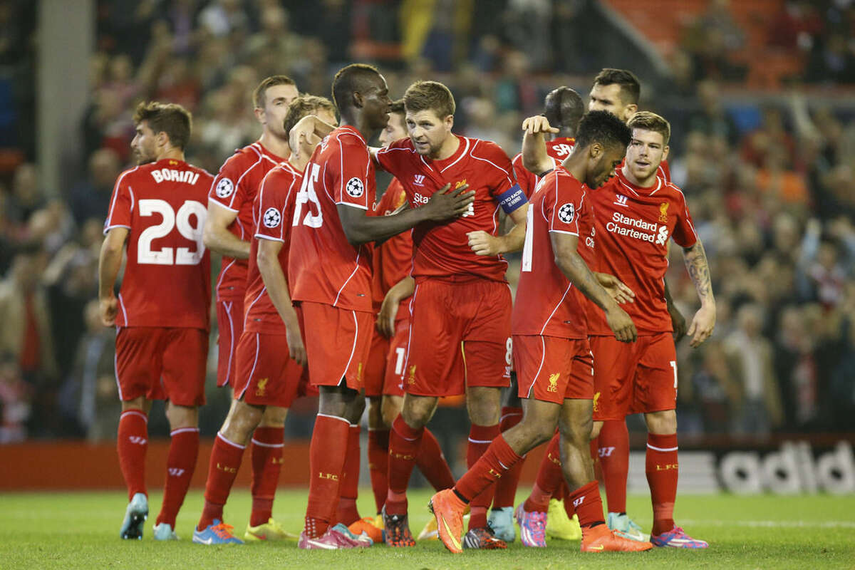 Liverpool's Steven Gerrard, center, celebrates with teammates after scoring against Ludogorets during the Champions League Group B soccer match between Liverpool and Ludogorets at Anfield Stadium in Liverpool, England, Tuesday, Oct. 16, 2014. (AP Photo/Jon Super)