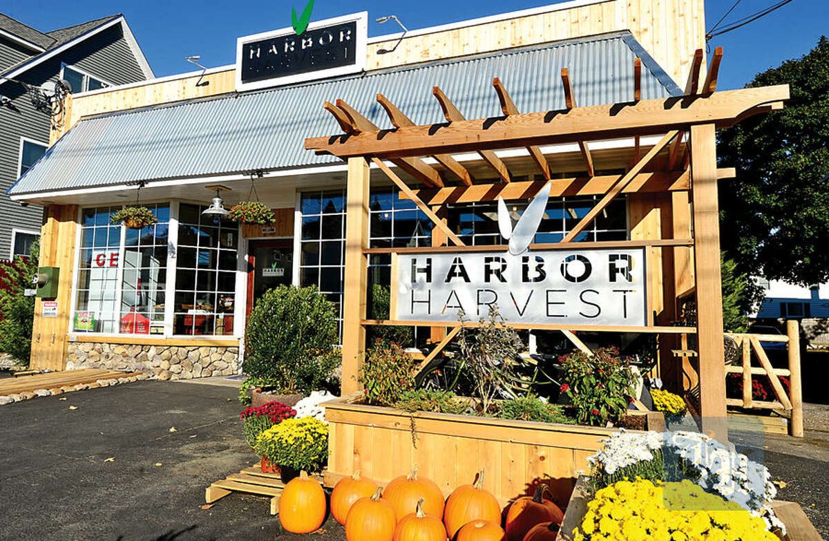 Hour photo / Erik Trautmann Co owners Bob Kunkel and Ernie Marsan have renovated the old Market Basket building on Cove Ave and opened as Harbor Harvest on Friday specializing in fresh local products.