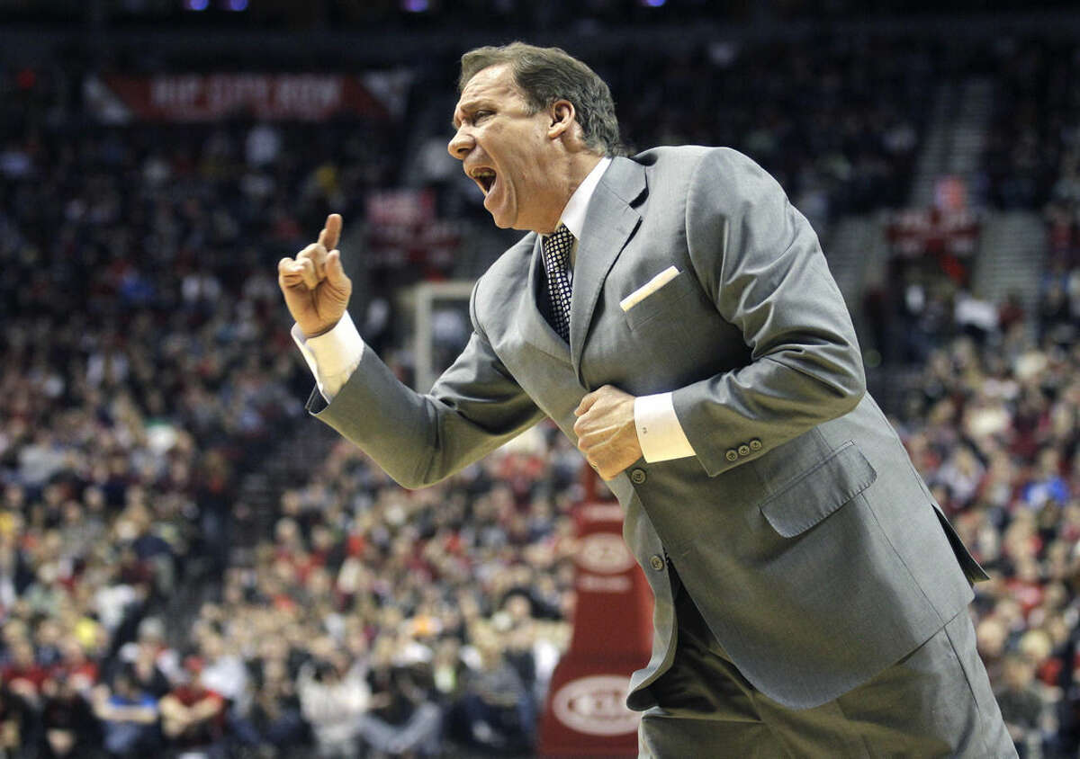 FILE - In this March 22, 2011, file photo, Washington Wizards head coach Flip Saunders shouts at an official in the second quarter of an NBA basketball game against the Portland Trail Blazers in Portland, Ore. Saunders, the longtime NBA coach who won more than 650 games in nearly two decades and was trying to rebuild the Minnesota Timberwolves as team president, coach and part owner, died Sunday, Oct. 25, 2015, the team said. He was 60. (AP Photo/Rick Bowmer, File)