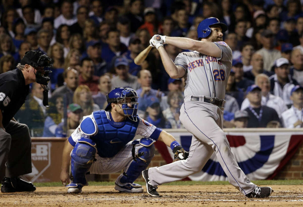 New York Mets' Daniel Murphy hits a home run during the third inning of Game 3 of the National League baseball championship series against the Chicago Cubs Tuesday, Oct. 20, 2015, in Chicago. (AP Photo/David J. Phillip)