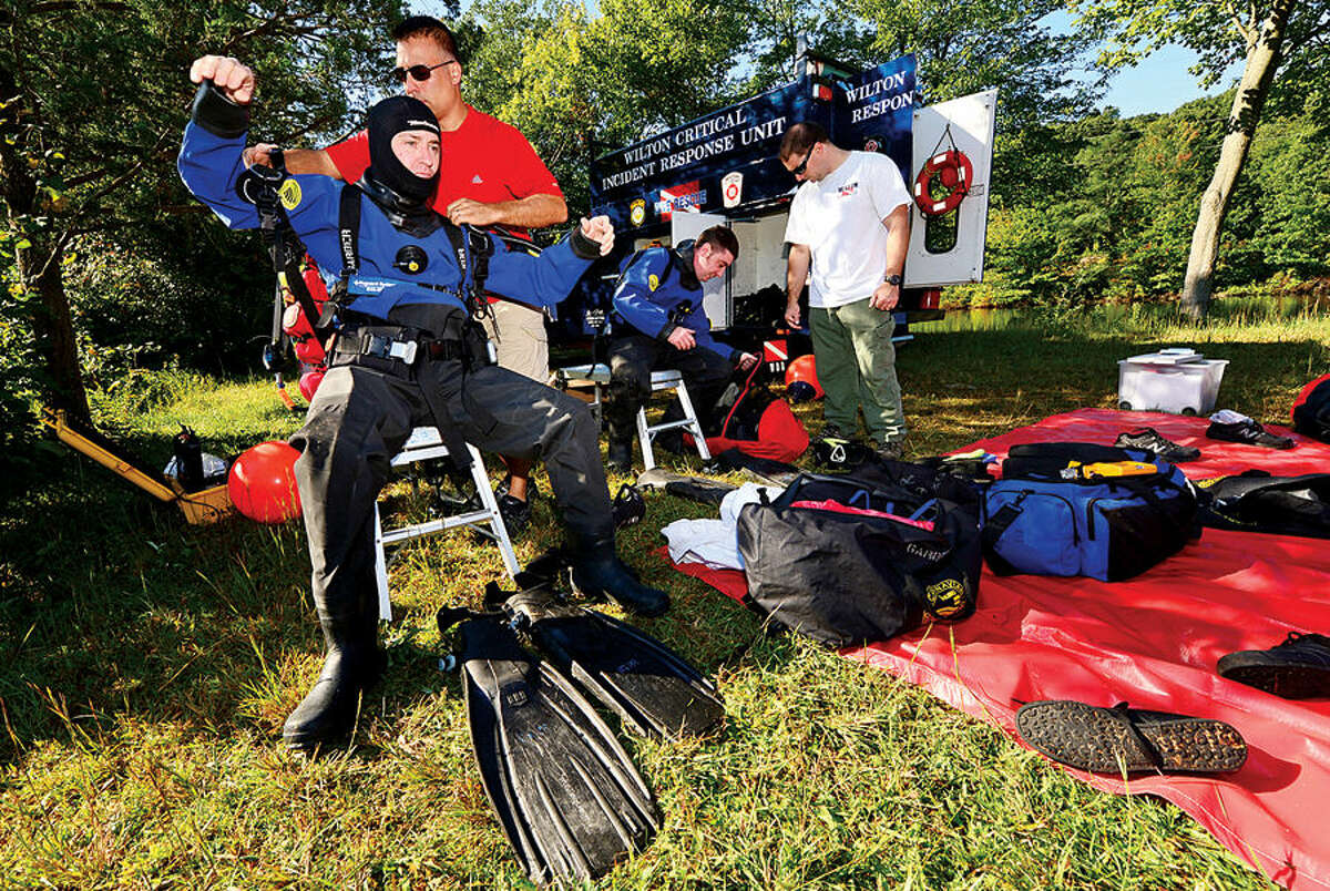 Wilton and Westport police and fire departments conduct water rescue training with their dive units in Wilton.
