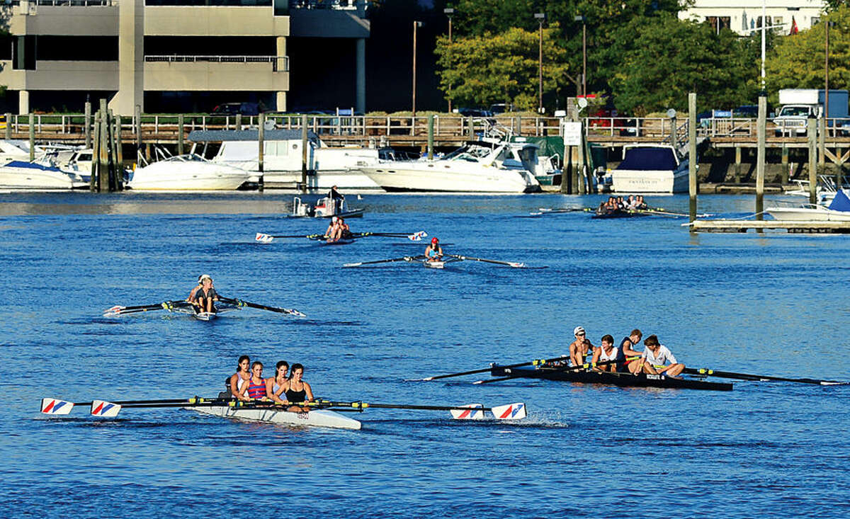 Hour photo / Erik Trautmann Rowing clubs take to the water on the Norwalk River Friday.
