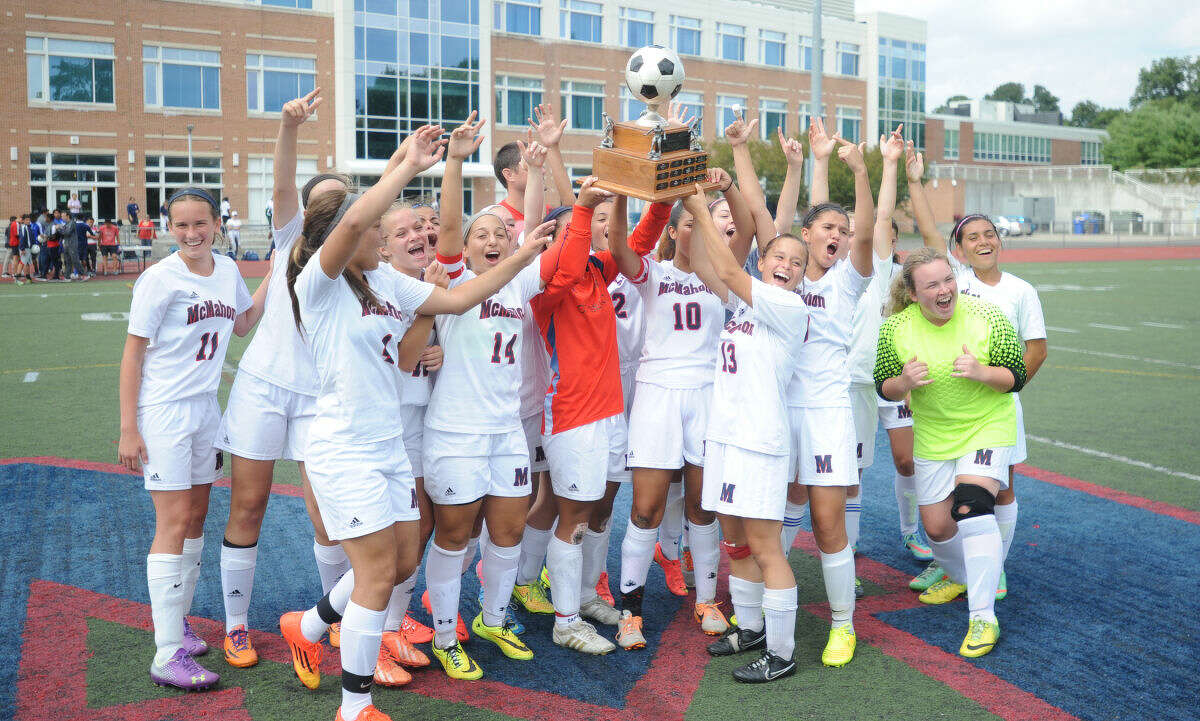 The Brien McMahon girls soccer team celebrates its 3-0 win over Norwalk on Saturday.