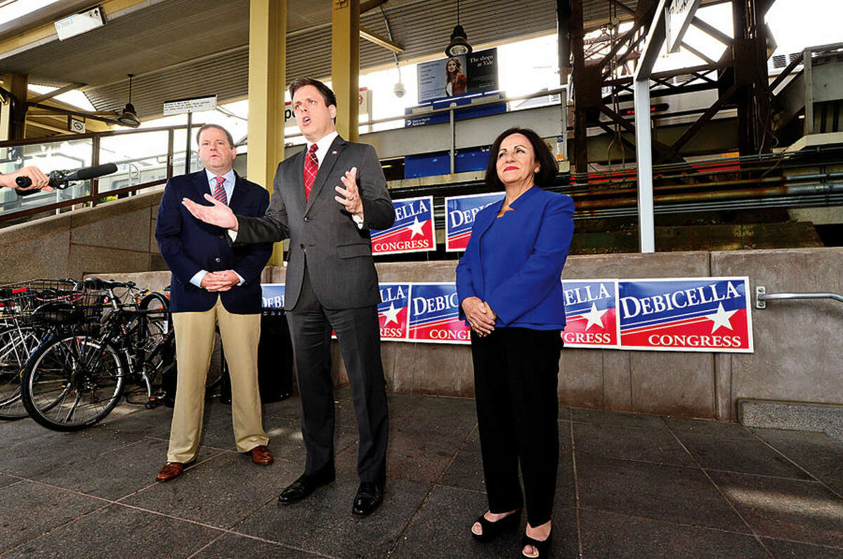 Hour photo / Erik Trautmann Dan Debicella, businessman and GOP candidate for the 4th Congressionl District seat makes a transportation announcement at the Westport train station Wednesday with support from Senate Minority Leader John McKinney and State Senator Toni Boucher (R-26).