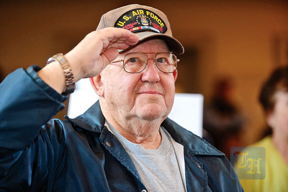 Hour photo / Erik Trautmann Air Force Veteran Joe Witkowski salutes during The Official Air Force Service Song The Norwalk Veterans Memorial Committee holds their 2015 Veterans Day Ceremony Wednesday at the Norwalk Concert Hall.
