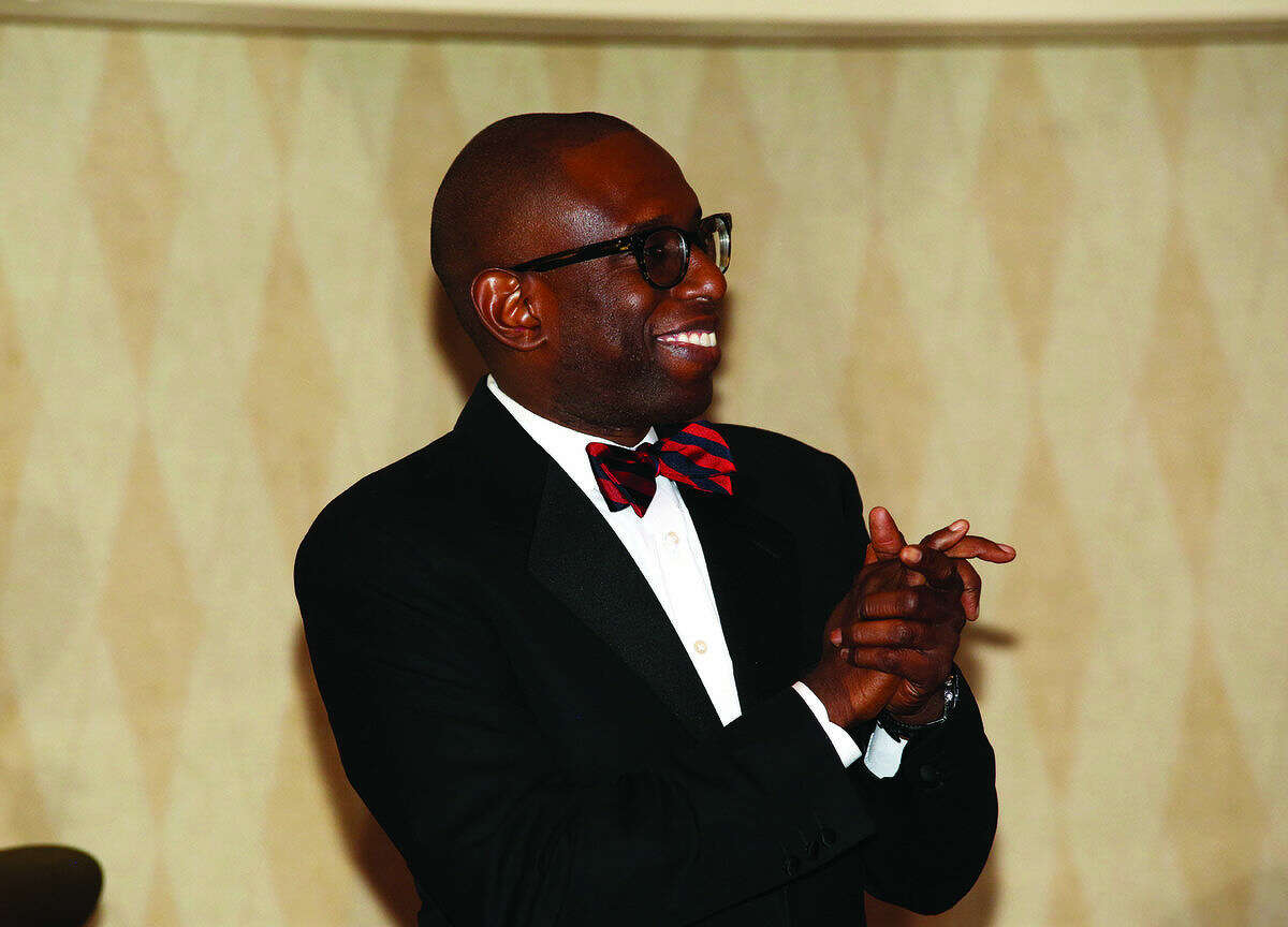 Darnell D. Crosland, Esq. applaudes during the Norwalk NAACP's Fourteenth Annual Freedom Fund Banquet at The Water's Edge at Giovanni's in Darien Friday night. Hour Photo / Danielle Calloway