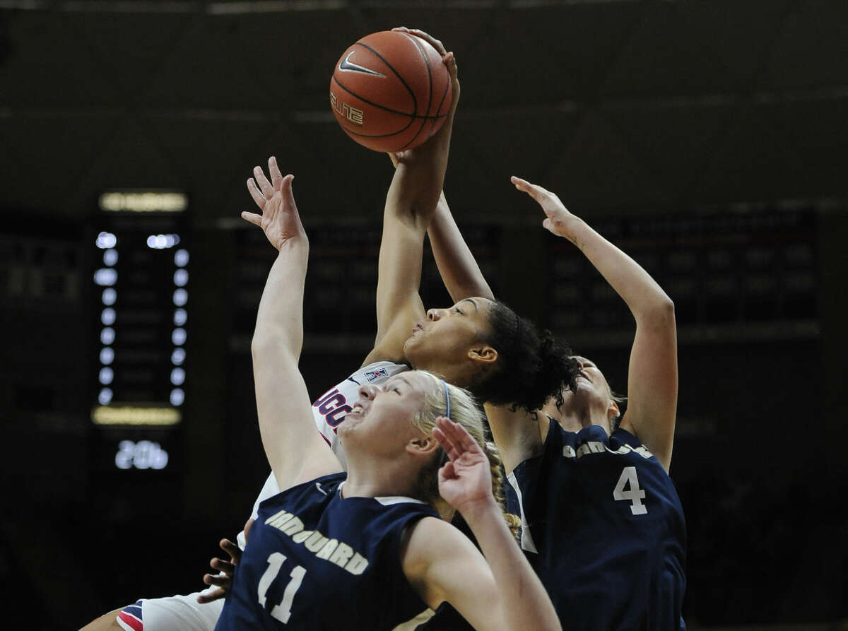 Connecticut’s Gabby Williams, center, pulls down a rebound against Vanguard’s Jaime Goff, left, and Melissa Norman, right, during the first half of an NCAA college exhibition basketball game Sunday, Nov. 8, 2015, in Storrs, Conn. (AP Photo/Jessica Hill)