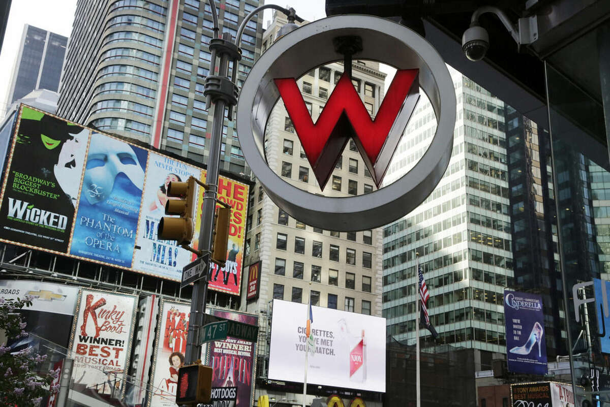 FILE - In this Wednesday, July 31, 2013, file photo, the logo for the W Hotel, owned by Starwood Hotels & Resorts Worldwide, is seen in New York's Times Square. Marriott International announced Monday, Nov. 16, 2015, it is buying rival hotel chain Starwood for $12.2 billion in a deal that will secure its position as the world's largest hotelier. (AP Photo/Mark Lennihan, File)