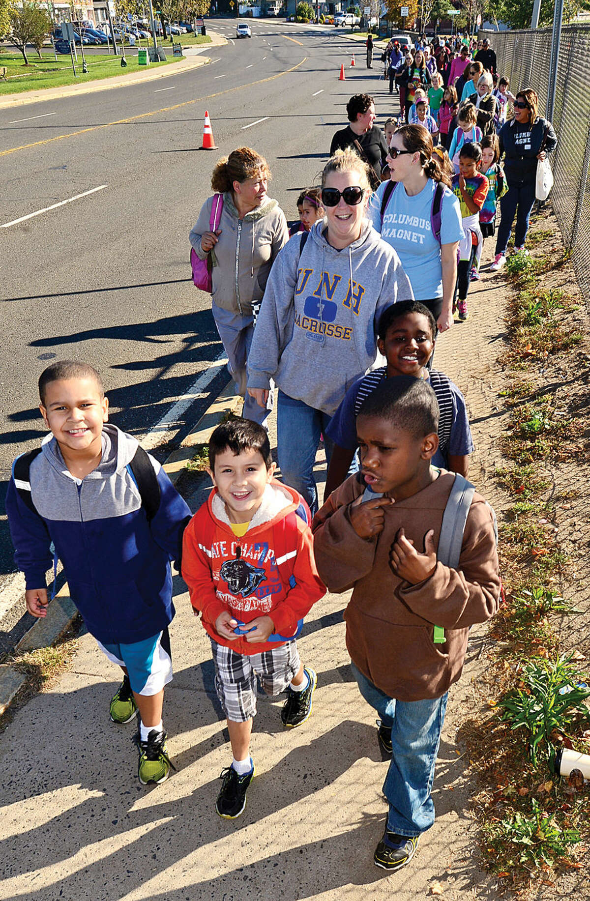 Hour photo / Erik Trautmann As part of its new Healthy Habits Initiative, Columbus Magnet School holds their first Walk to School Day with students, staff, parents, Norwalk Health Department staff and the Greater Norwalk Healthy Living Workgroup from Veteran's Memorial Park the the school Friday morning.